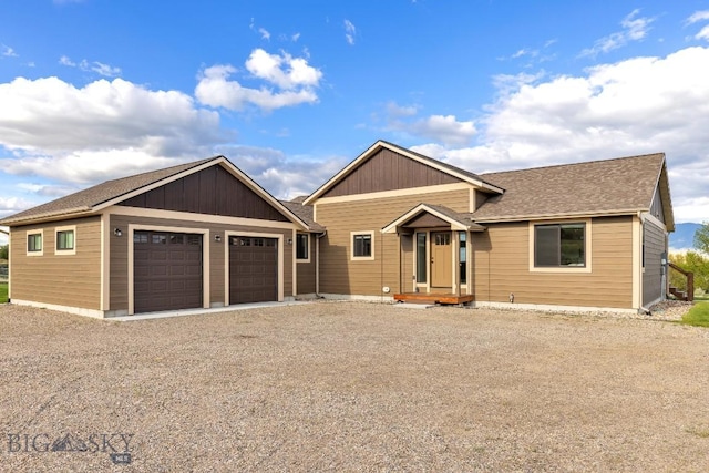 9 Cedar Ct, Ennis, MT 59751 - view of front facade with an attached garage, gravel driveway, and a shingled roof