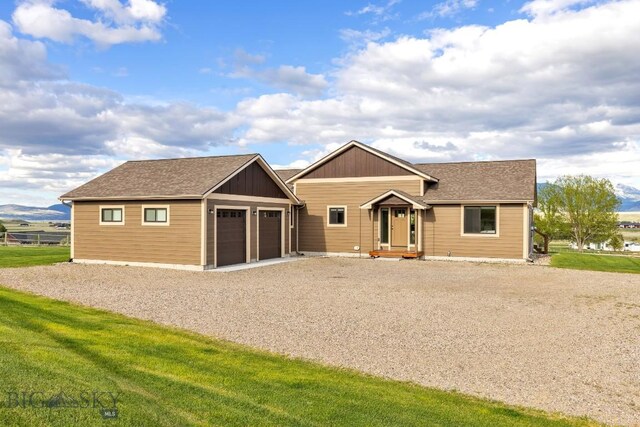 9 Cedar Ct, Ennis, MT 59751 - ranch-style house featuring driveway, a front yard, and a shingled roof