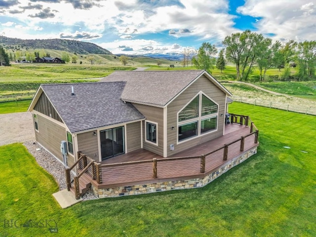 9 Cedar Ct, Ennis, MT 59751 - rear view of house with roof with shingles and a deck with mountain view