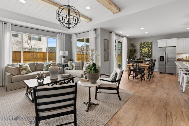 1516 Wild Bill Way, Belgrade, MT 59714 - living area with light wood-type flooring, recessed lighting, beam ceiling, and a chandelier