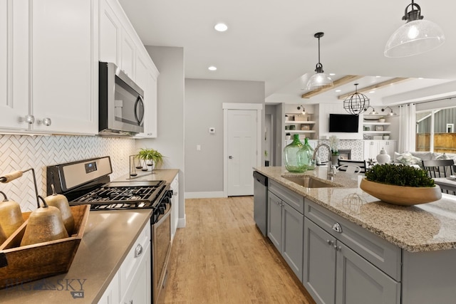 1516 Wild Bill Way, Belgrade, MT 59714 - kitchen with appliances with stainless steel finishes, gray cabinets, a sink, backsplash, and recessed lighting