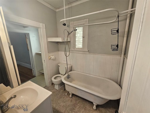 full bathroom with a shower, toilet, a bath, vanity, and wainscoting
