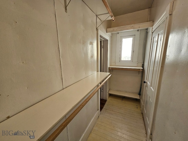 hall with light wood-type flooring