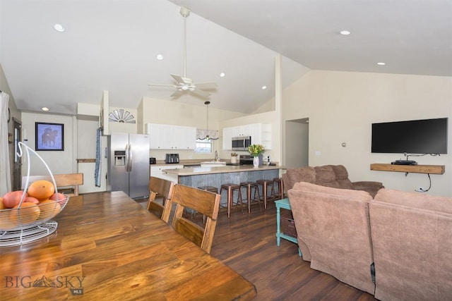 dining room with high vaulted ceiling, ceiling fan, dark wood-style floors, and recessed lighting
