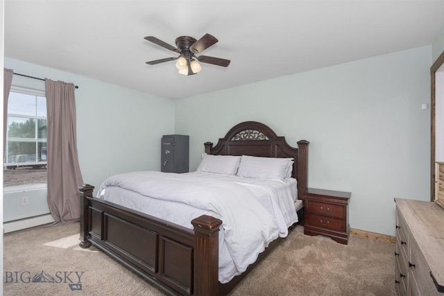 bedroom featuring a baseboard radiator, ceiling fan, and light carpet