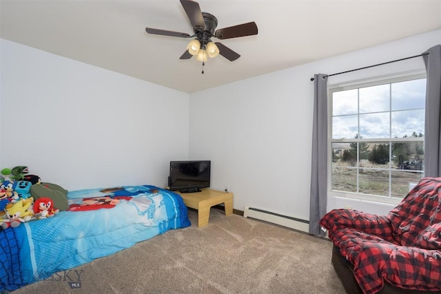 bedroom with a baseboard radiator, multiple windows, carpet, and a ceiling fan
