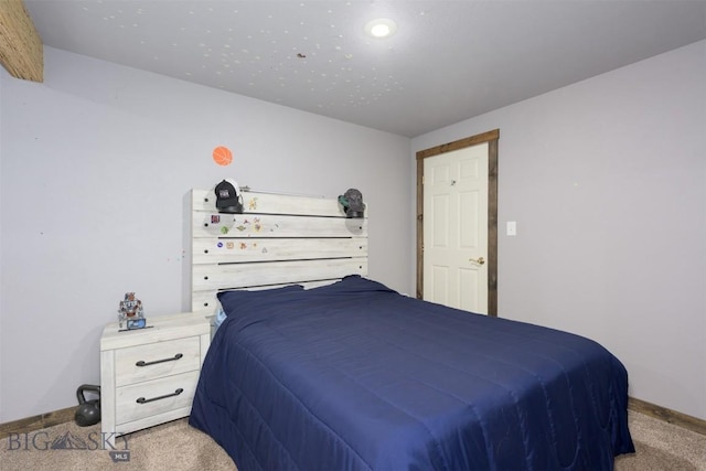 carpeted bedroom with baseboards