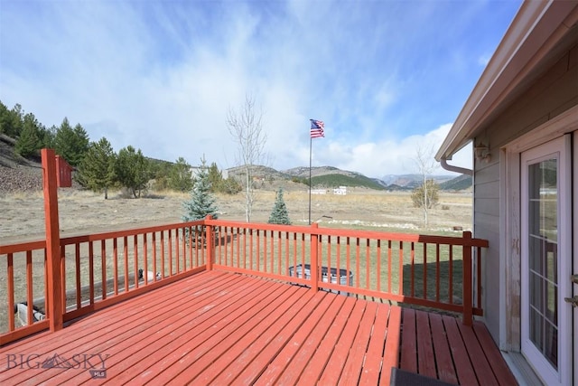 wooden terrace with a mountain view