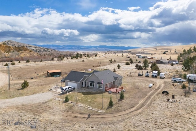 drone / aerial view featuring a mountain view and a rural view
