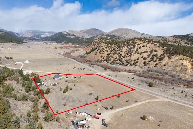 drone / aerial view with a rural view, a mountain view, and view of desert