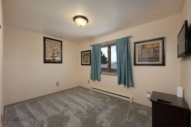 carpeted spare room featuring a baseboard radiator and baseboards