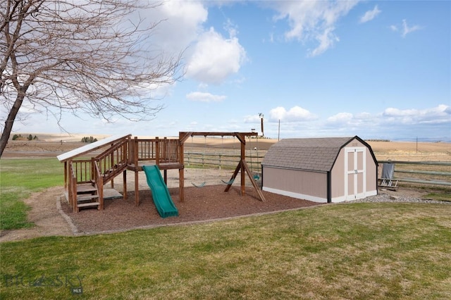 view of jungle gym featuring a storage shed, an outbuilding, fence, and a lawn