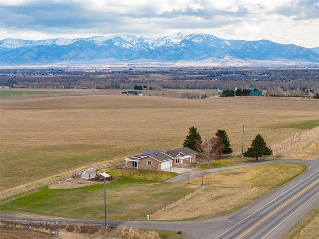 drone / aerial view featuring a rural view and a mountain view
