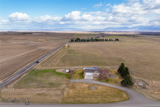 bird's eye view featuring a rural view and a mountain view