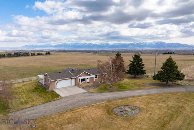 bird's eye view featuring a rural view and a mountain view