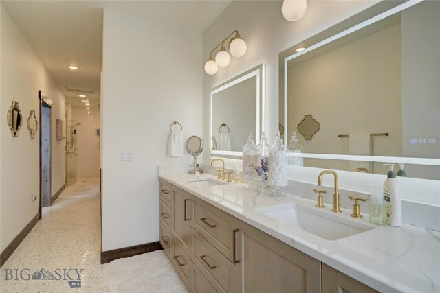 280 High Ridge Rd, Bozeman, MT 59715 - full bath featuring a shower stall, double vanity, a sink, and baseboards