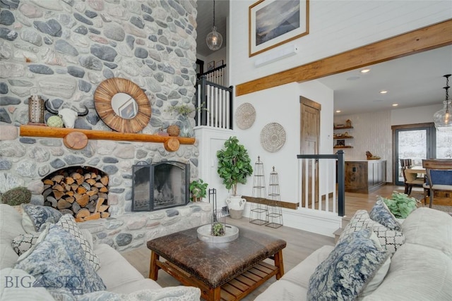 280 High Ridge Rd, Bozeman, MT 59715 - living area with recessed lighting, a stone fireplace, and wood finished floors