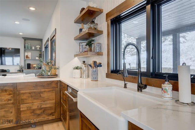 280 High Ridge Rd, Bozeman, MT 59715 - kitchen with a wealth of natural light, brown cabinets, light stone counters, and open shelves