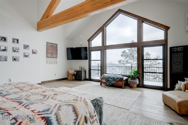 280 High Ridge Rd, Bozeman, MT 59715 - bedroom featuring beamed ceiling, access to exterior, high vaulted ceiling, and wood finished floors