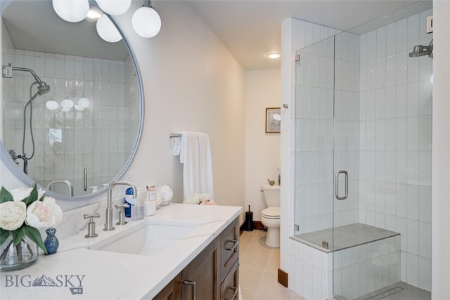 280 High Ridge Rd, Bozeman, MT 59715 - full bathroom featuring toilet, a stall shower, vanity, and tile patterned floors