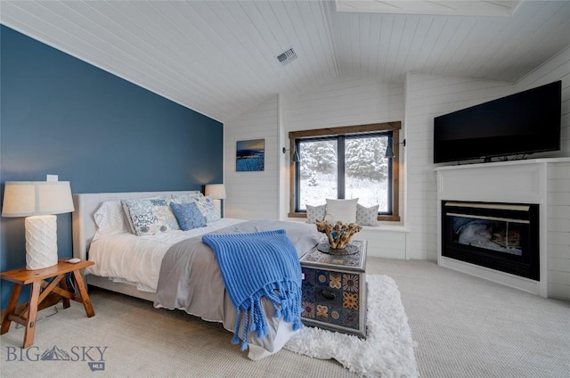 280 High Ridge Rd, Bozeman, MT 59715 - bedroom featuring a glass covered fireplace, visible vents, carpet floors, wooden ceiling, and lofted ceiling