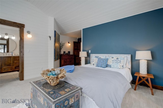 280 High Ridge Rd, Bozeman, MT 59715 - bedroom featuring wooden walls, carpet floors, and connected bathroom