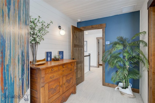 280 High Ridge Rd, Bozeman, MT 59715 - hall featuring visible vents, light carpet, and wood walls