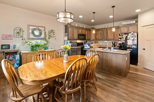 1519 Butler Crk Unit B, Belgrade, MT 59714 - dining area featuring light wood-style flooring and recessed lighting