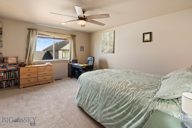 1519 Butler Crk Unit B, Belgrade, MT 59714 - bedroom featuring light carpet, ceiling fan, and a desk