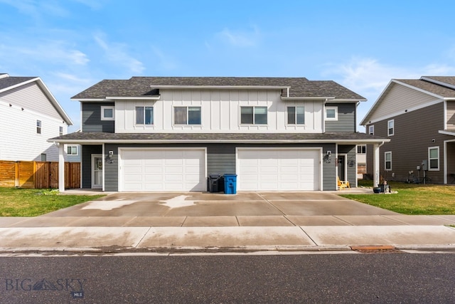 1519 Butler Crk Unit B, Belgrade, MT 59714 - view of front of property featuring board and batten siding, an attached garage, and concrete driveway