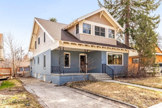 614 S 6th, Bozeman, MT 59715 - view of front facade featuring a porch, stucco siding, driveway, and roof with shingles