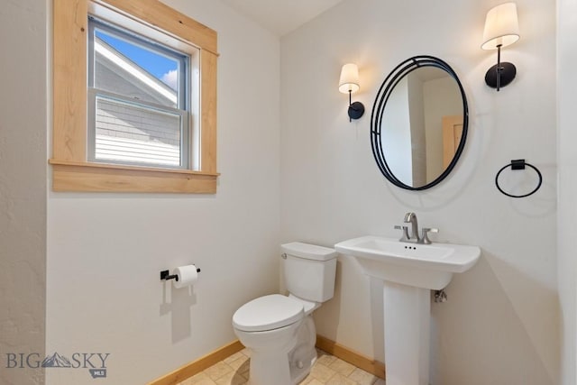 614 S 6th, Bozeman, MT 59715 - bathroom featuring toilet, a sink, and baseboards