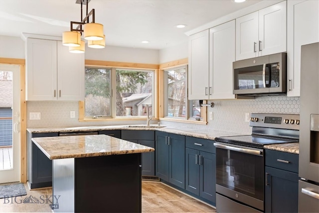614 S 6th, Bozeman, MT 59715 - kitchen with stainless steel appliances, plenty of natural light, a sink, and backsplash