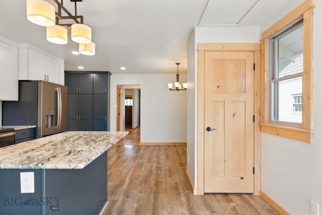 614 S 6th, Bozeman, MT 59715 - kitchen featuring stainless steel fridge with ice dispenser, light wood-type flooring, and baseboards