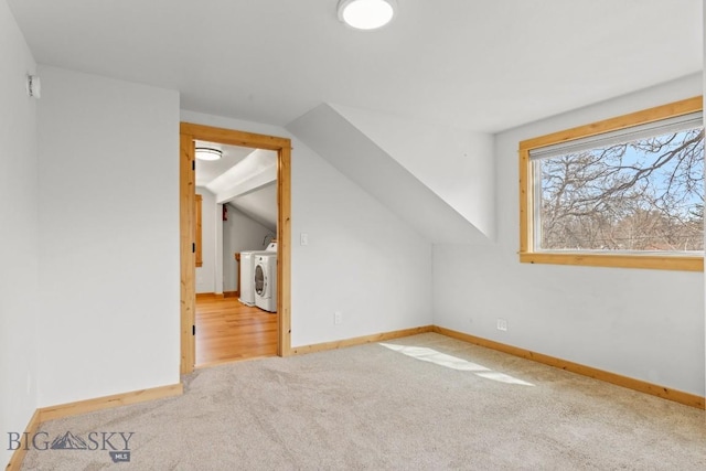 614 S 6th, Bozeman, MT 59715 - additional living space featuring vaulted ceiling, baseboards, carpet, and washing machine and dryer