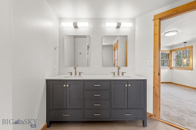 614 S 6th, Bozeman, MT 59715 - bathroom with double vanity, a sink, and baseboards