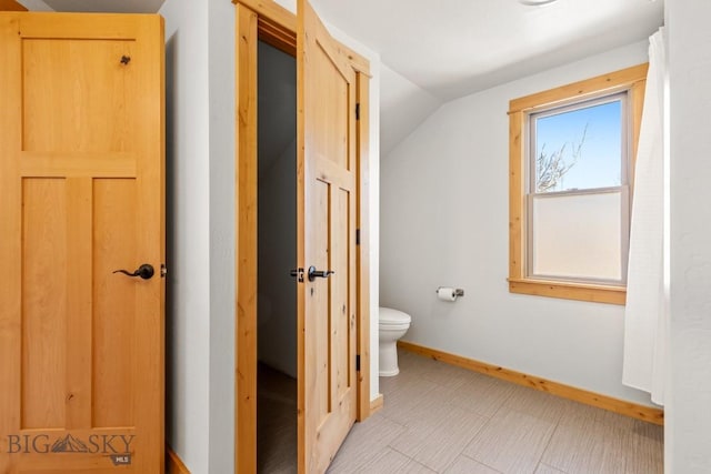 614 S 6th, Bozeman, MT 59715 - bathroom with toilet, vaulted ceiling, and baseboards
