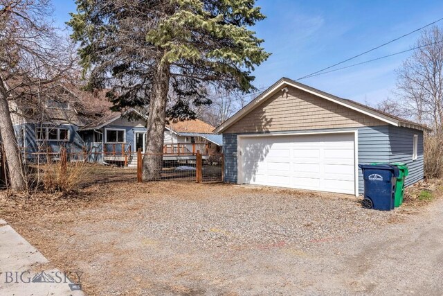 614 S 6th, Bozeman, MT 59715 - view of front facade with an outbuilding, a deck, and a detached garage