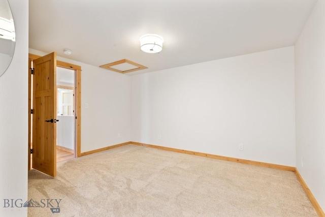 614 S 6th, Bozeman, MT 59715 - empty room featuring light carpet, attic access, and baseboards