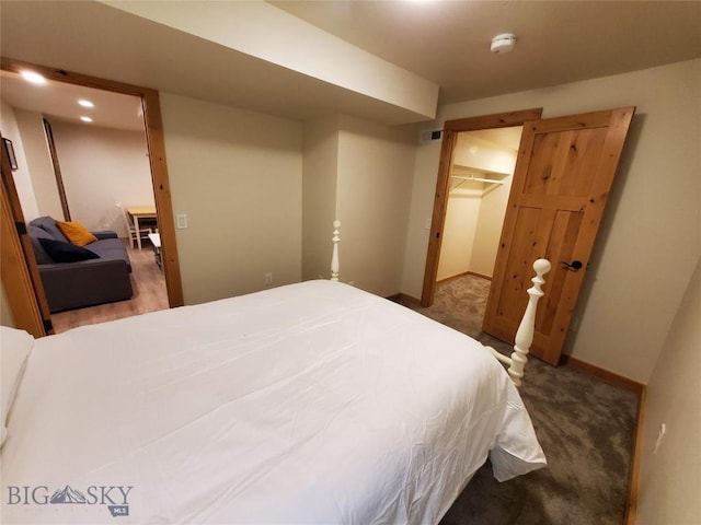 614 S 6th, Bozeman, MT 59715 - carpeted bedroom with a spacious closet, visible vents, and baseboards