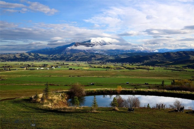 mountain view featuring a rural view and a water view