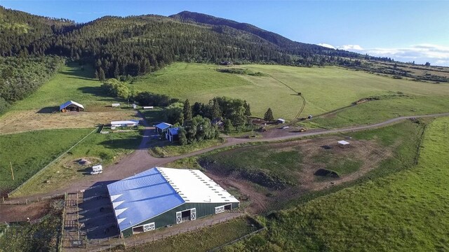 aerial view featuring a mountain view and a rural view