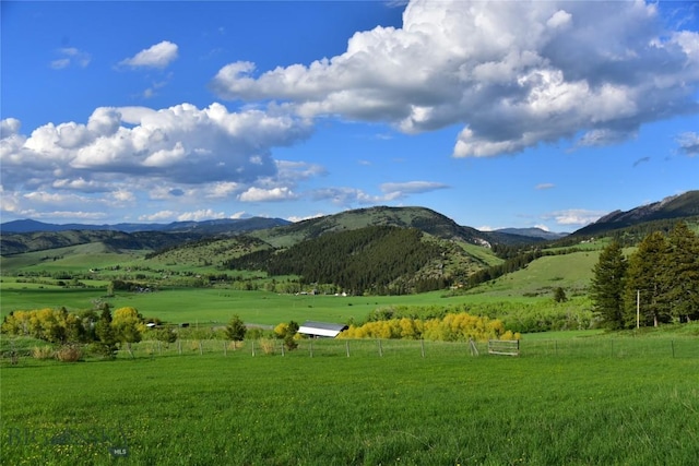 mountain view featuring a rural view