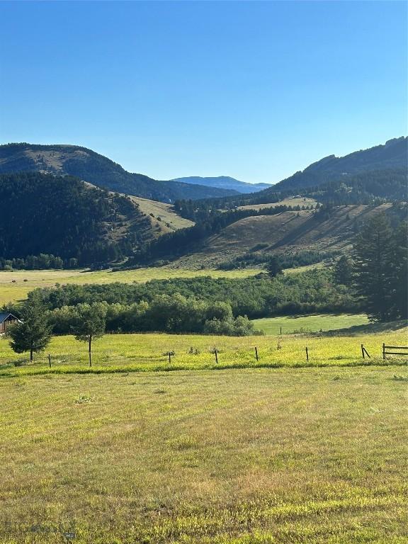mountain view featuring a rural view