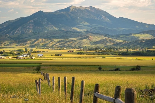 mountain view featuring a rural view