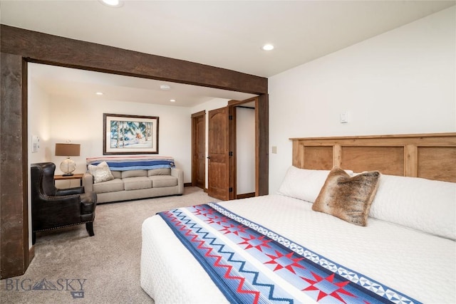 bedroom featuring recessed lighting and light carpet