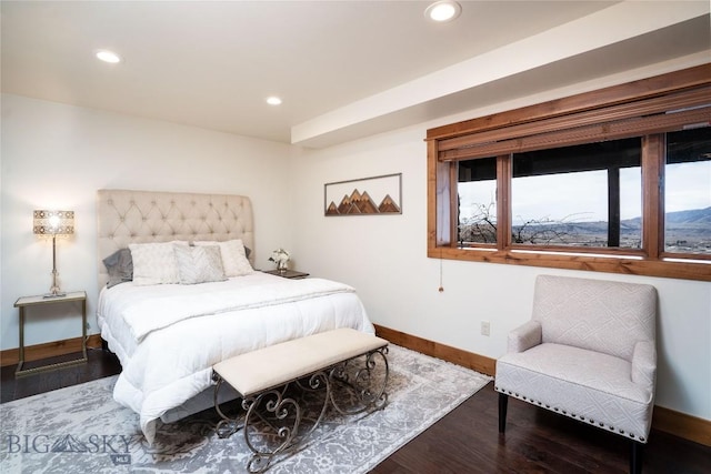 bedroom with wood finished floors, baseboards, and recessed lighting