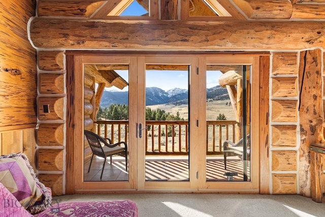 569/571 Cinnabar Basin Rd, Gardiner, MT 59030 - doorway to outside with a mountain view, carpet floors, and plenty of natural light