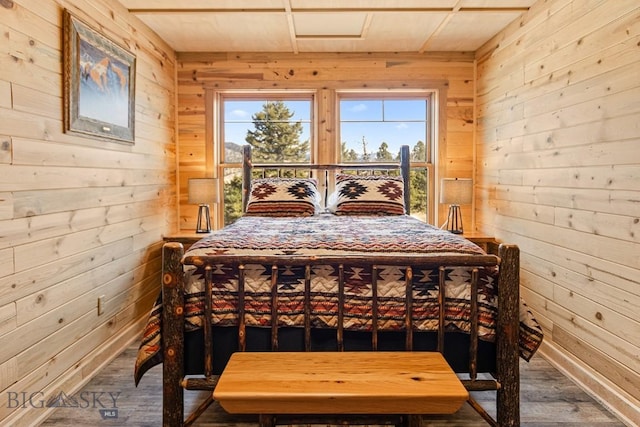 569/571 Cinnabar Basin Rd, Gardiner, MT 59030 - bedroom with wood walls and wood finished floors