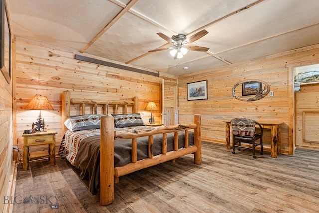 569/571 Cinnabar Basin Rd, Gardiner, MT 59030 - bedroom with wood walls and wood finished floors